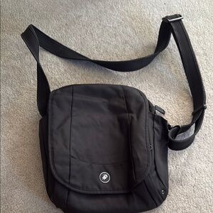 Pacsafe Black Messenger Bag with Durable Fabric and Adjustable Strap